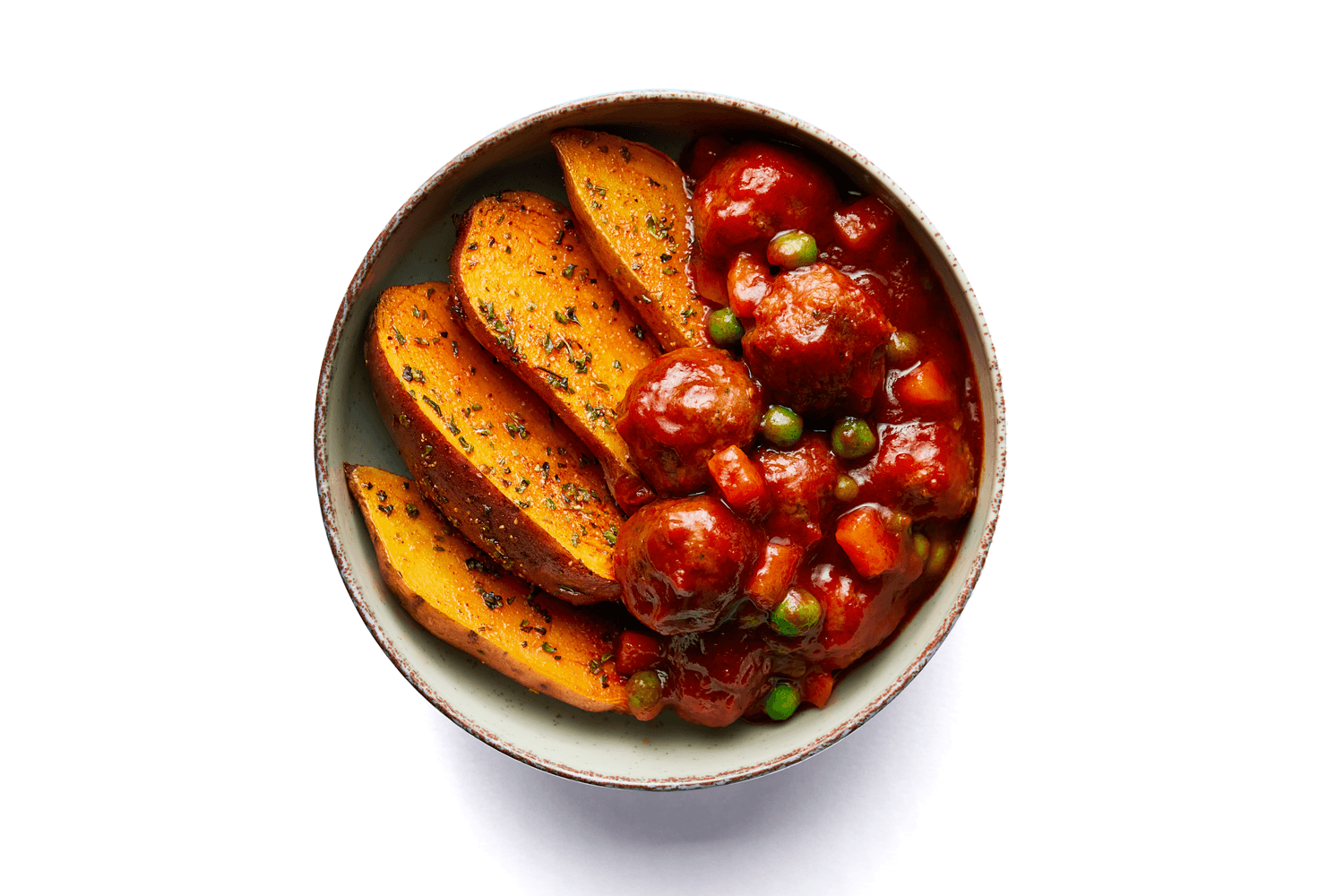 Albóndigas Heura® en salsa de tomate con boniato al chimichurri